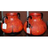 A pair of 20th century Art Deco style glass two-handled vases, mottled orange, red and yellow with