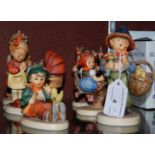 A group six Hummel figures comprising ‘Easter Greetings’, ‘Apple Tree Girl’, ‘Apple Tree Boy’, ‘