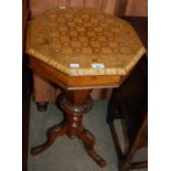 A 19th century mahogany octagonal sewing/ work table, the top with inlaid chequered detail.