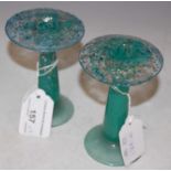 A rare of pair of Monart glass mushroom-shaped hatpin holders, mottled clear and green glass with