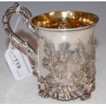 A Victorian silver christening mug, London 1840, makers mark obscured, embossed with figures,