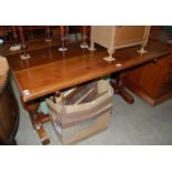 An early 20th century oak dining table