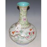 A Chinese porcelain famille rose bottle vase, bearing Qianlong seal mark, decorated with peach