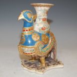 A late 19th/ early 20th century Japanese Satsuma pottery figure of a stylised bird supporting an