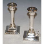 A pair of Birmingham silver candlesticks.