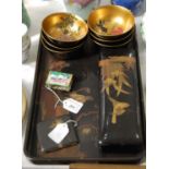 A small collection of Japanese lacquered items comprising a tray, a rectangular storage box, six