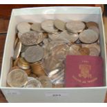 A box containing mixed coinage to include some pre-1919 silver coins, various commemorative