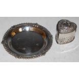 A small circular Birmingham silver tray, and a London silver heart-shaped box and cover embossed