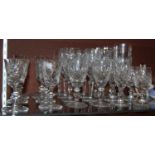 Collection of assorted cut glassware of various shapes and sizes.