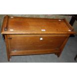 A 20th century oak and canvas concertina folding campaign bed, makers mark slightly faded,