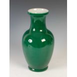 A Chinese porcelain green ground monochrome vase, 20th century, bearing six character Yongzheng mark
