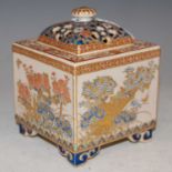 A late 19th century Japanese pottery koro and cover, with red, blue, white and green enamelled