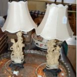 A pair of faux ivory table lamps and shades