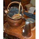 A group of copper items to include a helmet-shaped coal scuttle, tongs, a large pot, tankard,