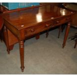 A 19th century mahogany side table with two long drawers raised on four turned supports.