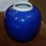 A Chinese porcelain powder blue ground jar, Qing Dynasty, four character mark, 17.5cm high.