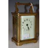 An early 20th century brass-cased carriage clock with Arabic numeral dial.