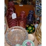 A group of assorted clear and coloured glassware to include four assorted decanters and stoppers,