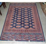 A blue ground Rami Persian style rug, decorated with rows of octagonal-shaped gulls within repeating