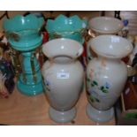 A pair of Victorian green glass lustres with gilded and painted details, together with a set of