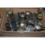 A group of mixed metalware comprising EPNS bottle stand, forks, baskets, other EPNS, pewter lidded