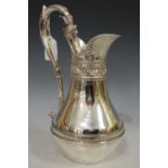 A Victorian silver claret jug, London 1870, makers mark of 'JB' over 'TB', the scroll handle with