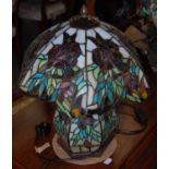 Three assorted Tiffany style leaded glass table lamps and shades together with another similar