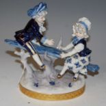 Volkstedt Rudolstadt, a porcelain figure group of a male and female on a sea-saw.