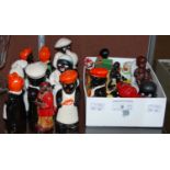 A collection of novelty figural cruets, modelled as black figures, etc.