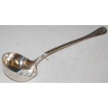 A Victorian silver soup ladle, London 1875, makers mark 'GA', the handle chased on both sides with