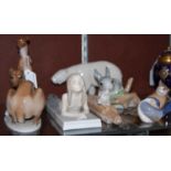 Seven assorted ceramic figure groups to include a Copenhagen model of a polar bear, Copenhagen model