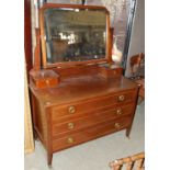 An Edwardian mahogany and chequer banded dressing table, the raised mirror back with two short