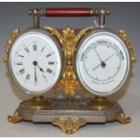 A late 19th / early 20th century white metal and gilt metal mounted combination desk clock / aneroid