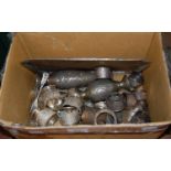 A box of mixed metalware to include tea strainer, napkin rings, bud vases, dishes, dessert forks,
