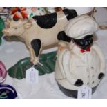 A cast metal doorstop in the form of a dairy cow, together with a cast iron money bank in the form