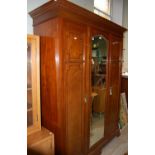 An Edwardian mahogany boxwood and rosewood banded mirror door wardrobe