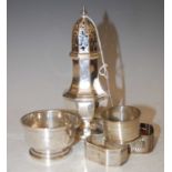 Collection of silver to include sugar caster, small footed bowl, and three assorted silver napkin