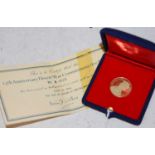 A yellow metal Metalimport Limited 25th Anniversary Desert War Commemorative medal, No.A0620,