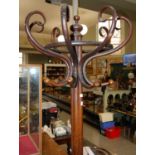 An early 20th century stained bentwood hat and coat stand