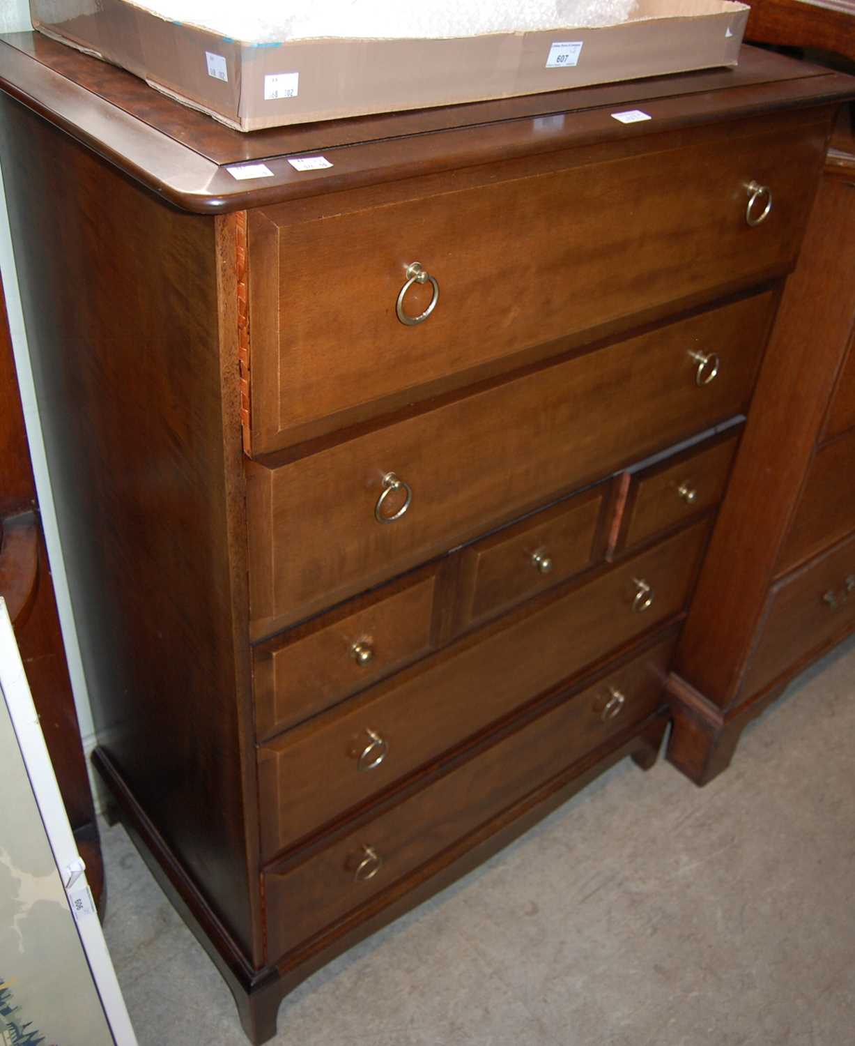 A Stag chest of seven drawers, together with a Stag bedside table