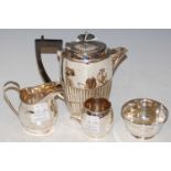 A collection of silver to include a Neoclassical style hot water pot with part gadrooned decoration,