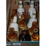 Collection of whisky miniatures comprising four Bells Scotch Whisky commemorative decanters by