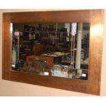 A modern Glasgow School style copper framed rectangular wall mirror/ overmantle with mottled