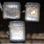 Three vintage silver vesta holders, two with Birmingham silver hallmarks, the other with London