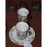 A Sheffield silver mounted part coffee set comprising five Sheffield silver cup frames, two with