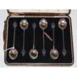 A cased set of six Birmingham silver coffee spoons with bean terminals