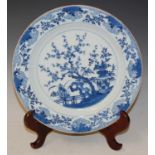 A Chinese blue and white porcelain charger, Qing Dynasty, decorated with fenced garden of prunus