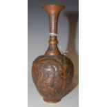 An Antique Persian copper bottle vase, with embossed decoration of figures, 18cm high