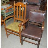 An early 20th century oak Arts & Crafts style elbow chair with needlework upholstered seat