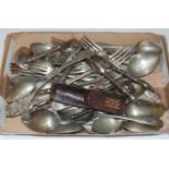 A collection of assorted white metal flatware, electroplated nut cracks, etc